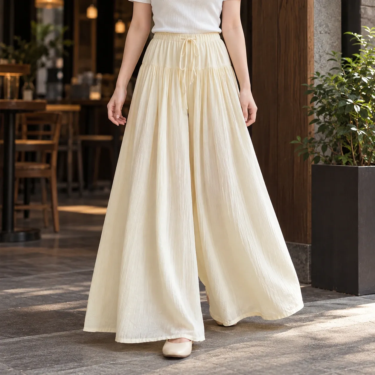 Apolline Tiered Wide-Leg Trousers - Apricot front fit; styling accessories not included